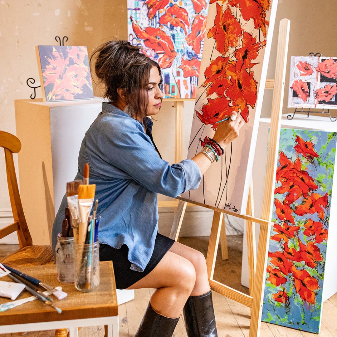 yolanda painting poppies on her easel